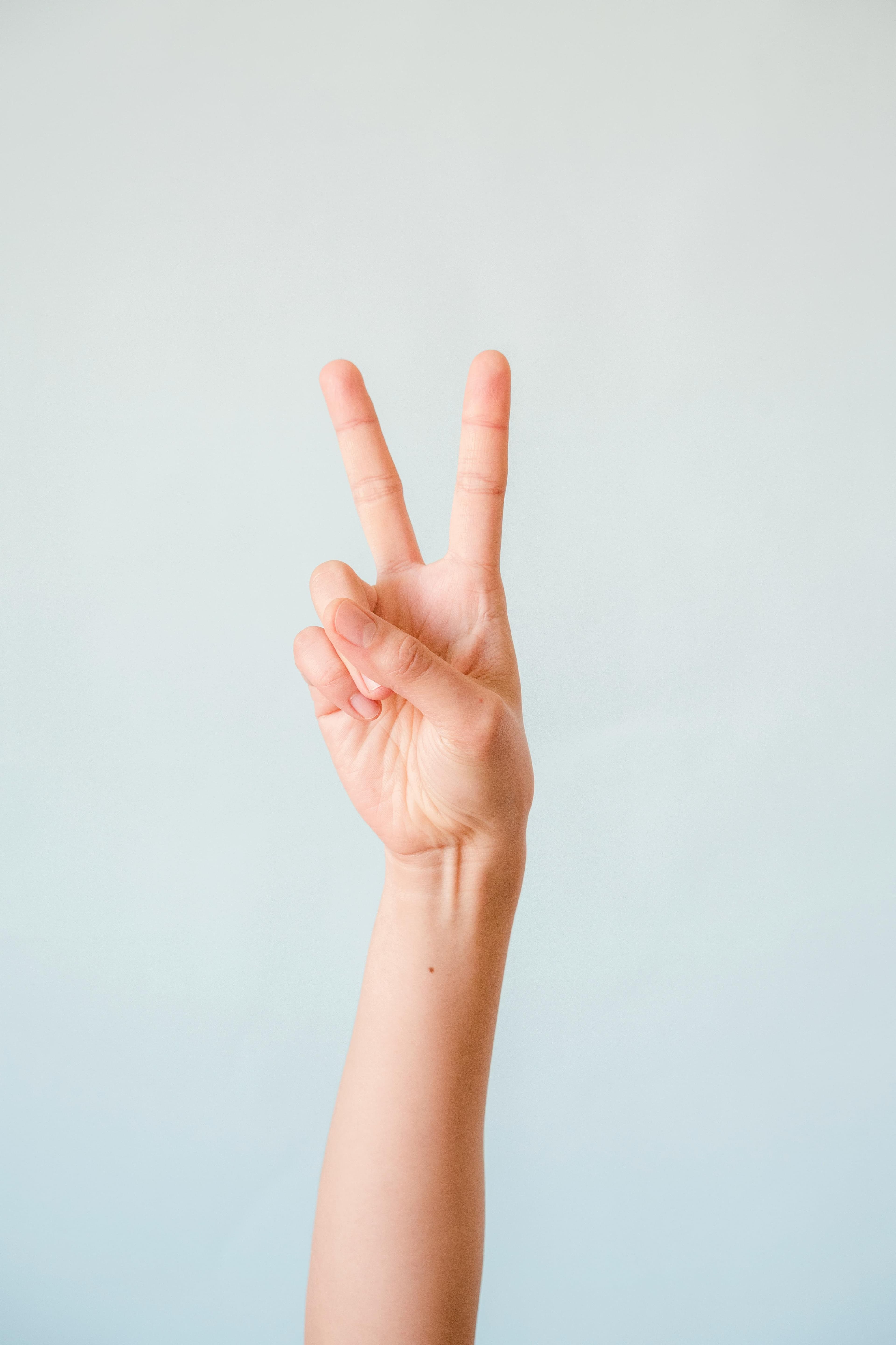 Hand displaying two fingers.