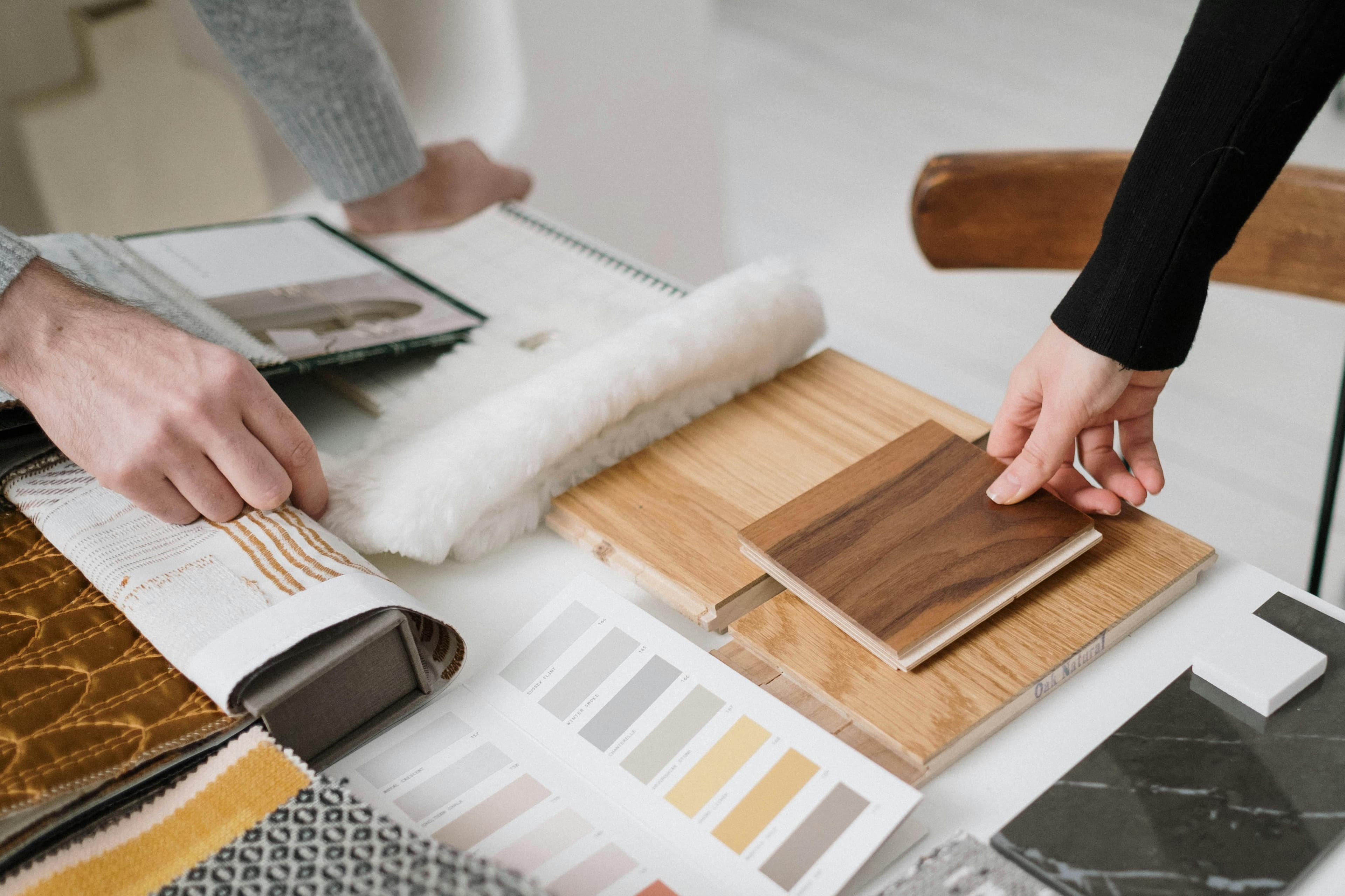Designers comparing wood and selecting colors.